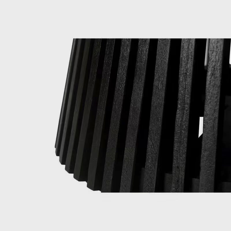 Close-up of the black dining table's vertical slats