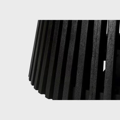 Close-up of the black dining table's vertical slats
