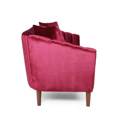 Wine Red Channel-Tufted Sofa — side view of flared arm and wood legs.