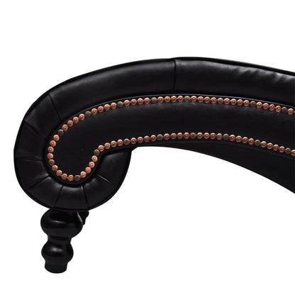 Close-up of the chaise's rolled lower end, two rows of nailhead trim, and turned front foot.