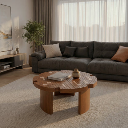 Flower-petal coffee table with patchwork-style top before a dark sofa