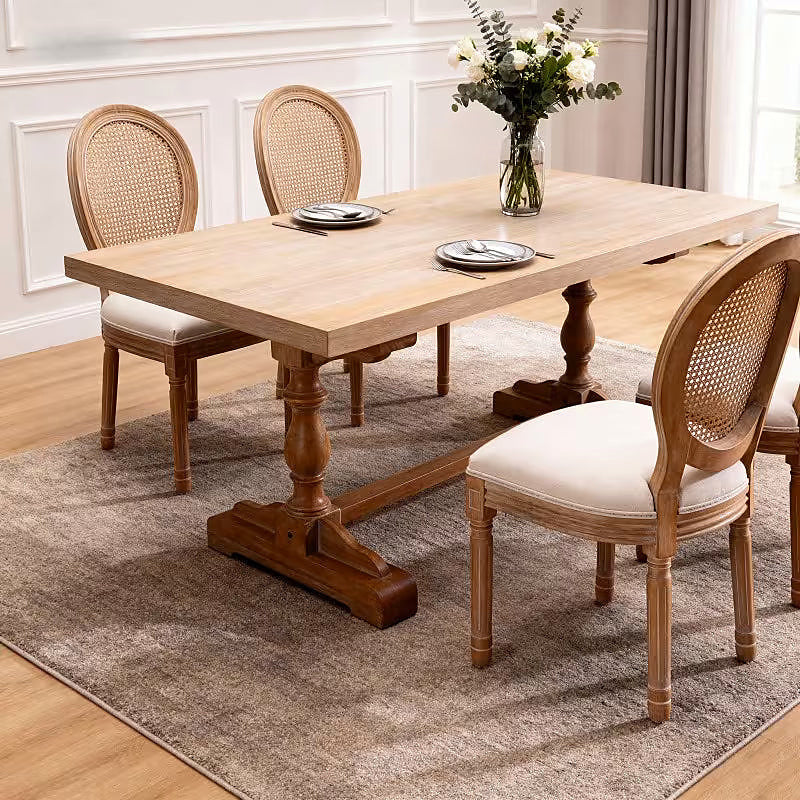 French style dining chair with a woven rattan back and beige upholstered seat