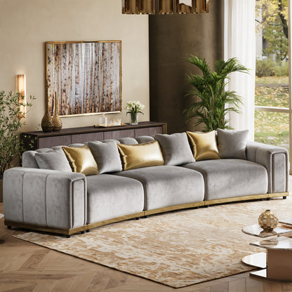 Curved Velvet Sofa with Metal Trim — grey upholstery option.