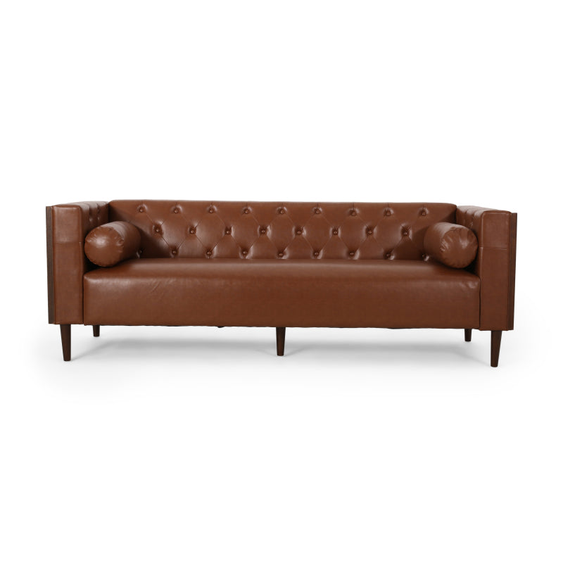 Cognac Button-Tufted Sofa with Bolster Pillows — front product view with bolster pillows.