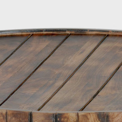 Close-up of the raised rim and plank-style top of the round coffee table