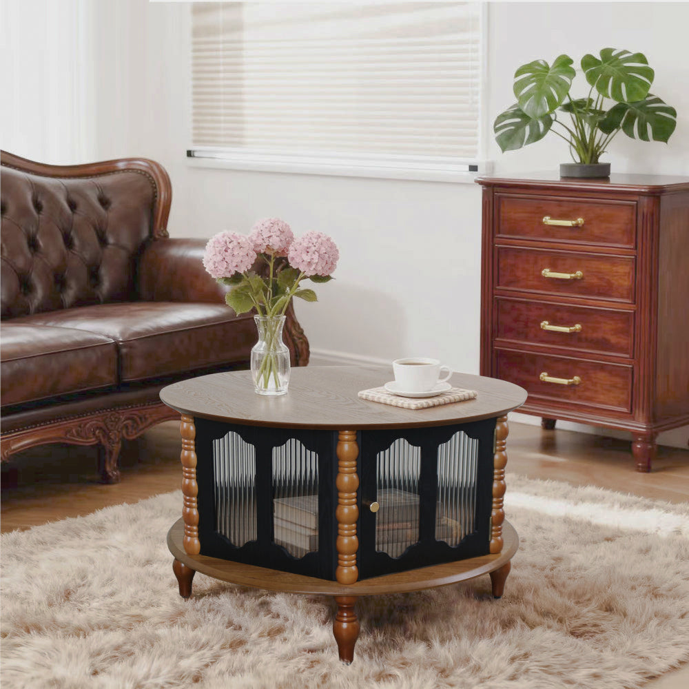 Round wood-look coffee table with ribbed black doors in a bright living room