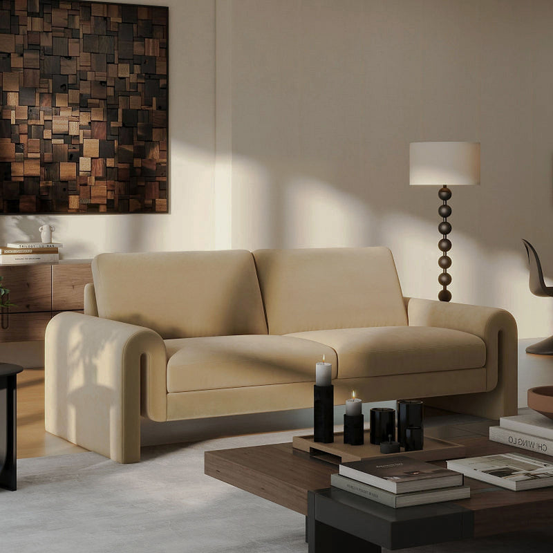Beige Mason velvet sofa with open arched arms and two seat cushions in a styled living room.