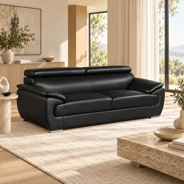 Sterling Black Leather Sofa — in a bright neutral living room
