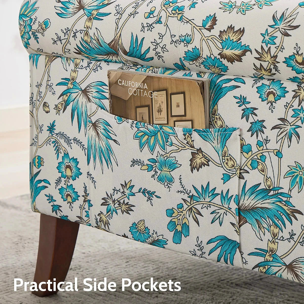 Ivory and blue floral wingback chair with dark wood legs and a side pocket — side pocket detail