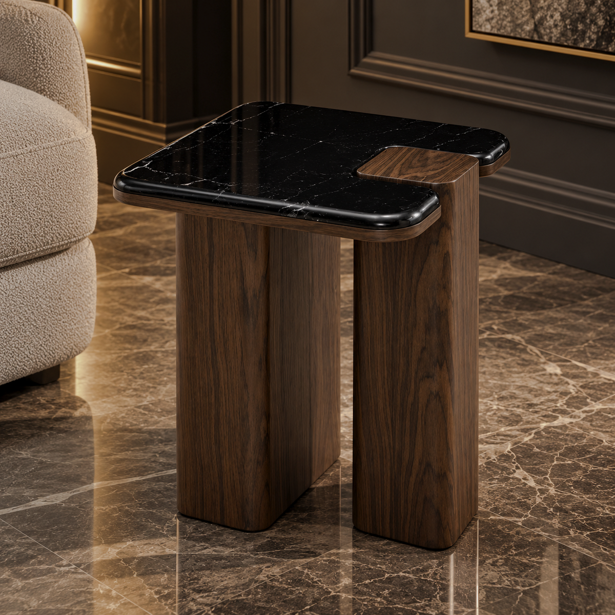 Black marble-look end table with rounded square top and dark brown split-panel supports beside a beige chair