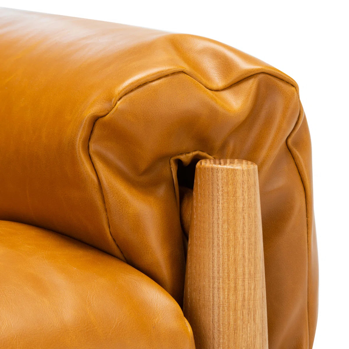 Strap-Detail Wood-Frame Accent Chair — caramel upholstery and wood arm close-up