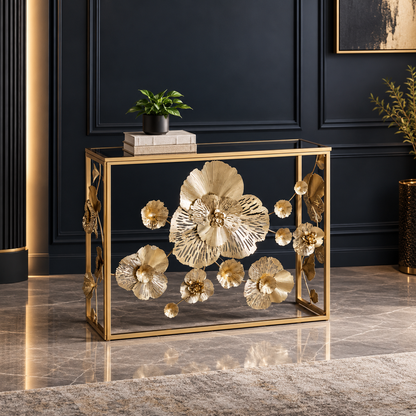 Gold-tone floral console with mirrored top styled against a dark paneled wall.