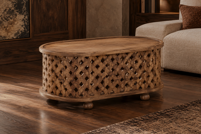 Angled view of an oval brown coffee table with a lattice-style side