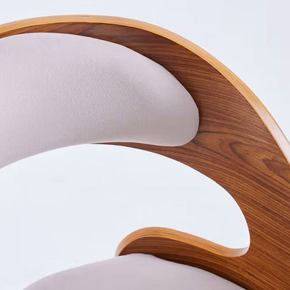 White upholstered dining chair with a curved brown wood look back