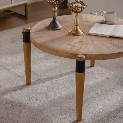 Close view of radial-pattern wood tabletop and black leg collars