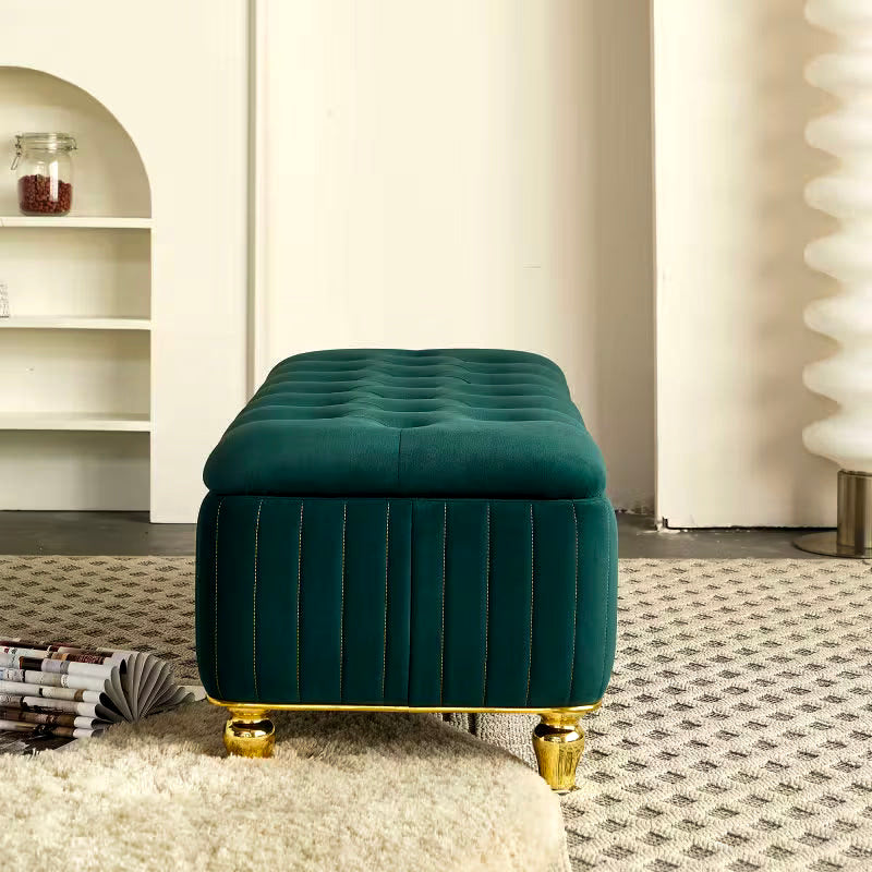 End view of the green rectangular bench with channeled sides and short gold-tone feet
