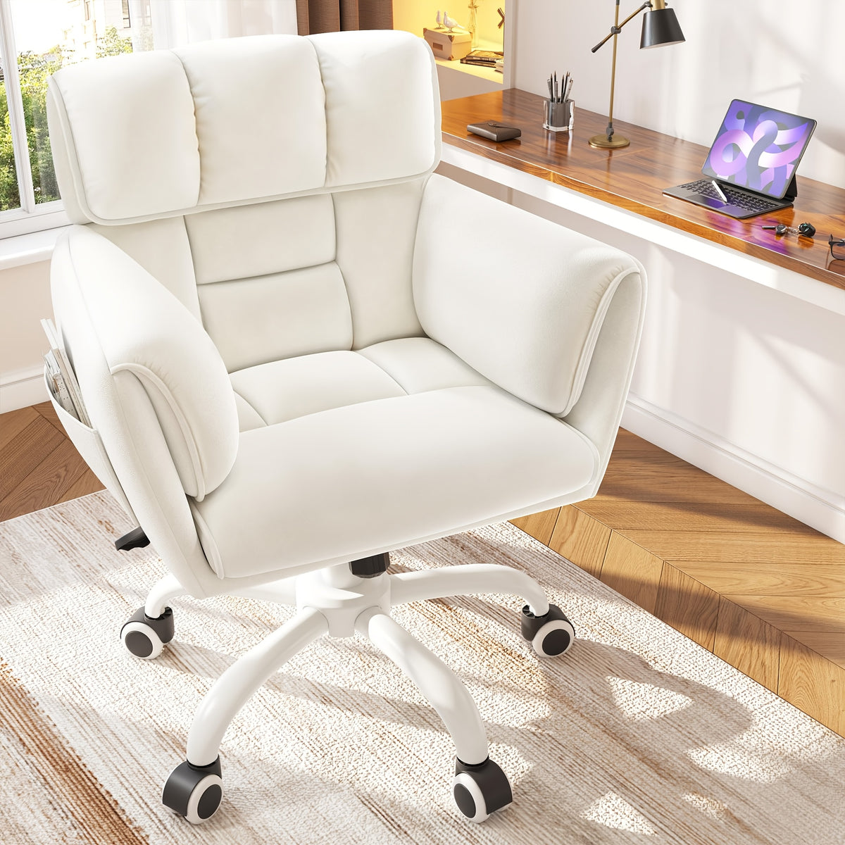 White padded swivel chair beside a desk