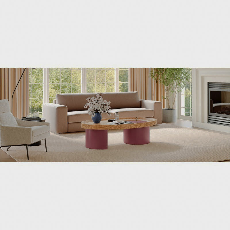 Oval wood-look coffee table with red supports in a bright living room