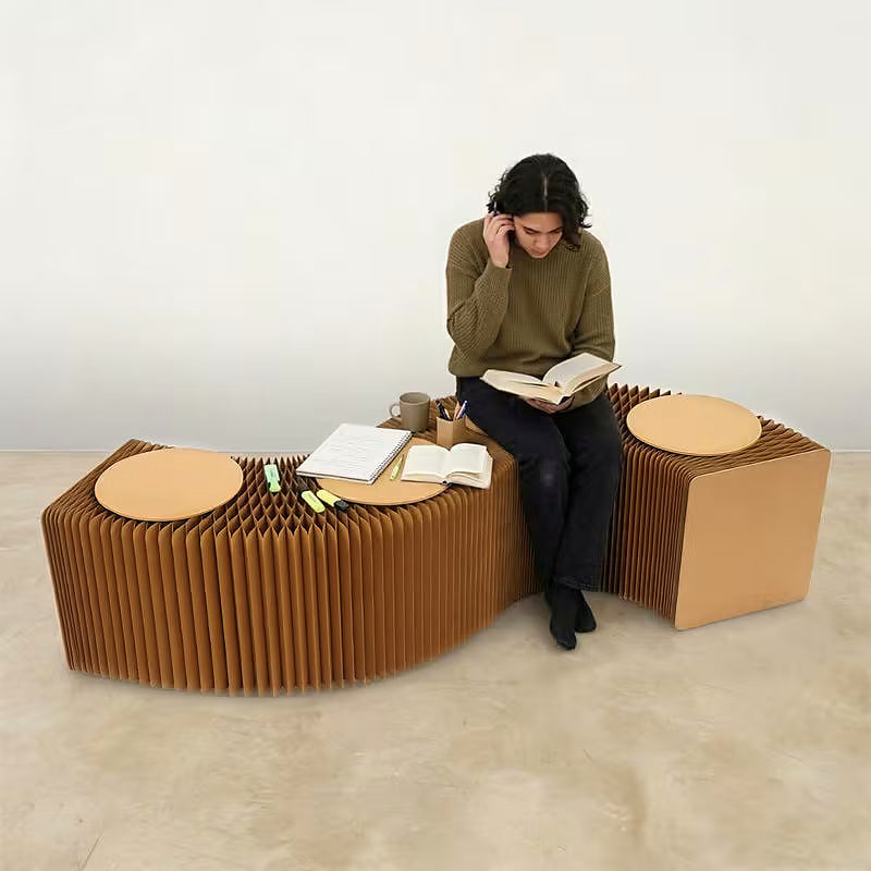 Expandable kraft paper accordion bench with round seat pads — expanded straight configuration