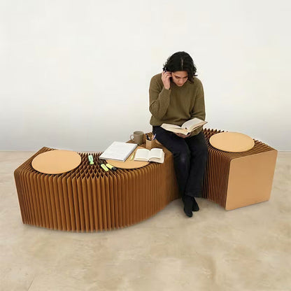 Expandable kraft paper accordion bench with round seat pads — expanded straight configuration