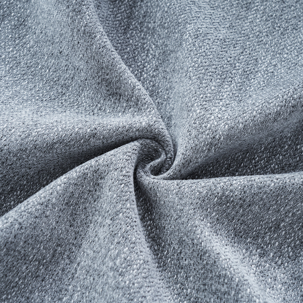 Blue-Grey Curved Sofa with Damask Pillows — blue-grey fabric texture close-up.