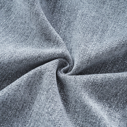 Blue-Grey Curved Sofa with Damask Pillows — blue-grey fabric texture close-up.