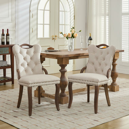 Beige velvet dining chair with a tufted back, wood handle, and curved wood legs