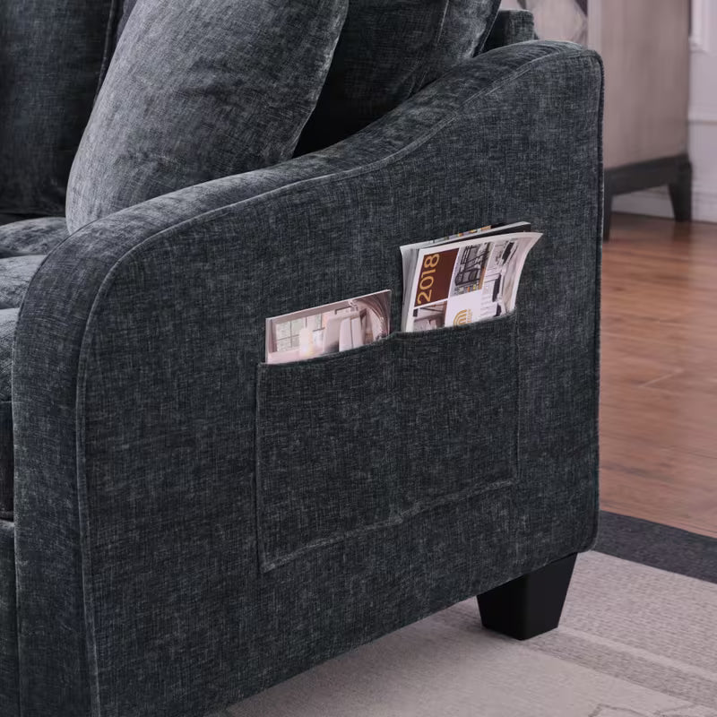 Tufted Loveseat with Storage Footrest — side pocket holding magazines.