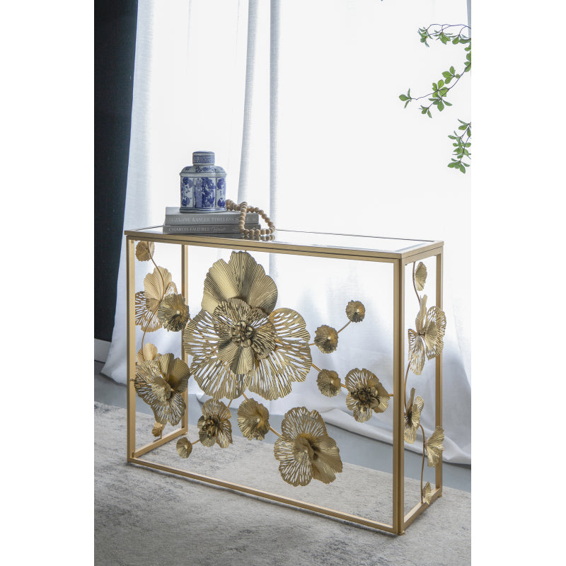 Angled room view of the floral console showing its mirrored glass top.
