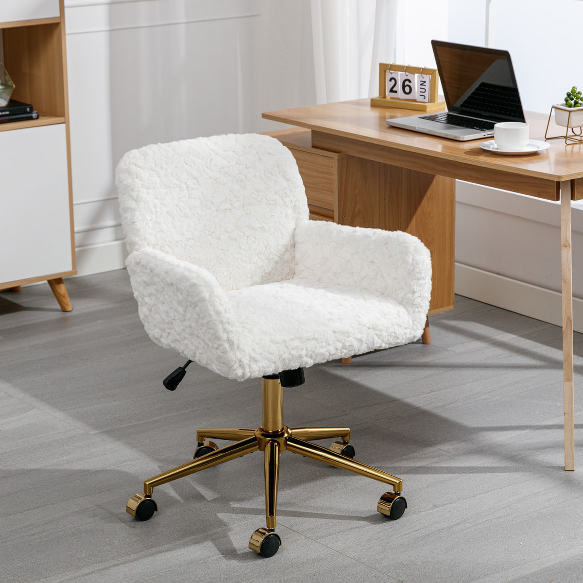 Three-quarter view of the white padded swivel chair