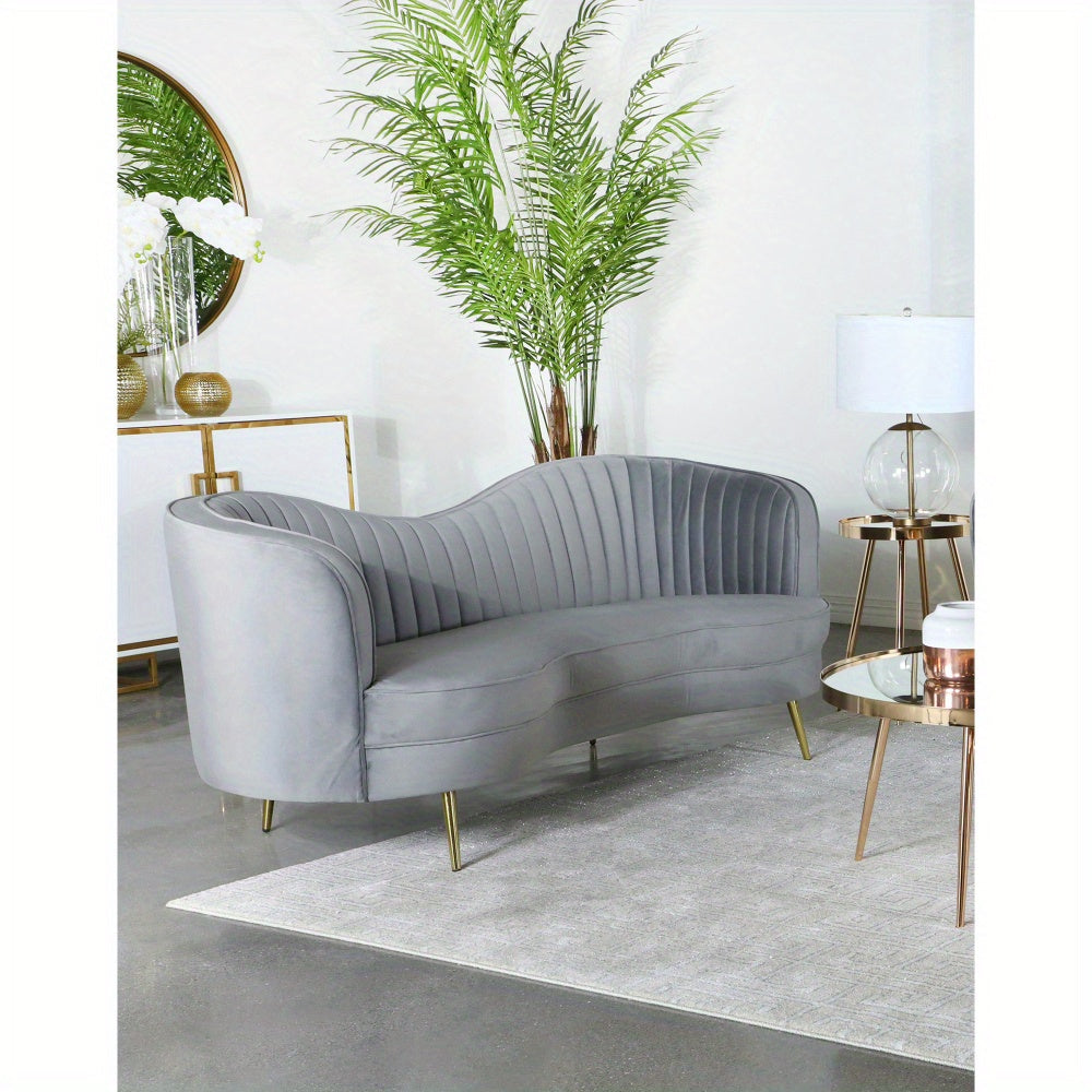 Grey Channel-Tufted Sofa with Gold-Tone Legs — sofa in a contemporary room.
