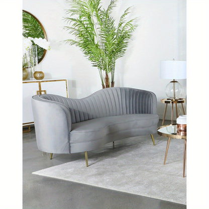 Grey Channel-Tufted Sofa with Gold-Tone Legs — sofa in a contemporary room.