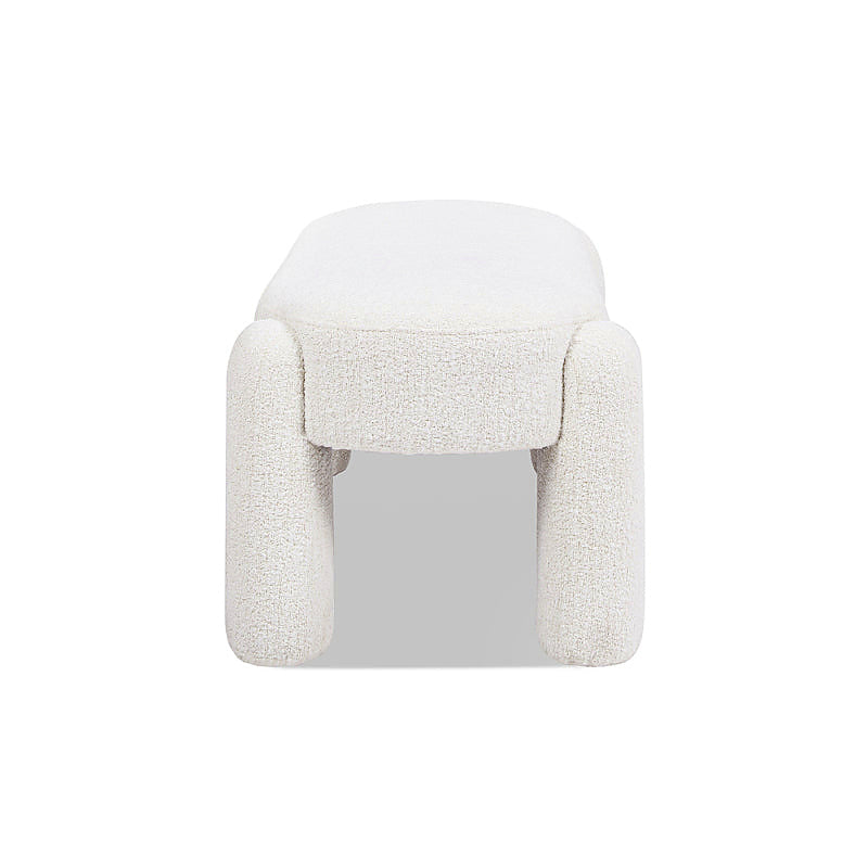 End profile of the cream oval upholstered Hugo bench