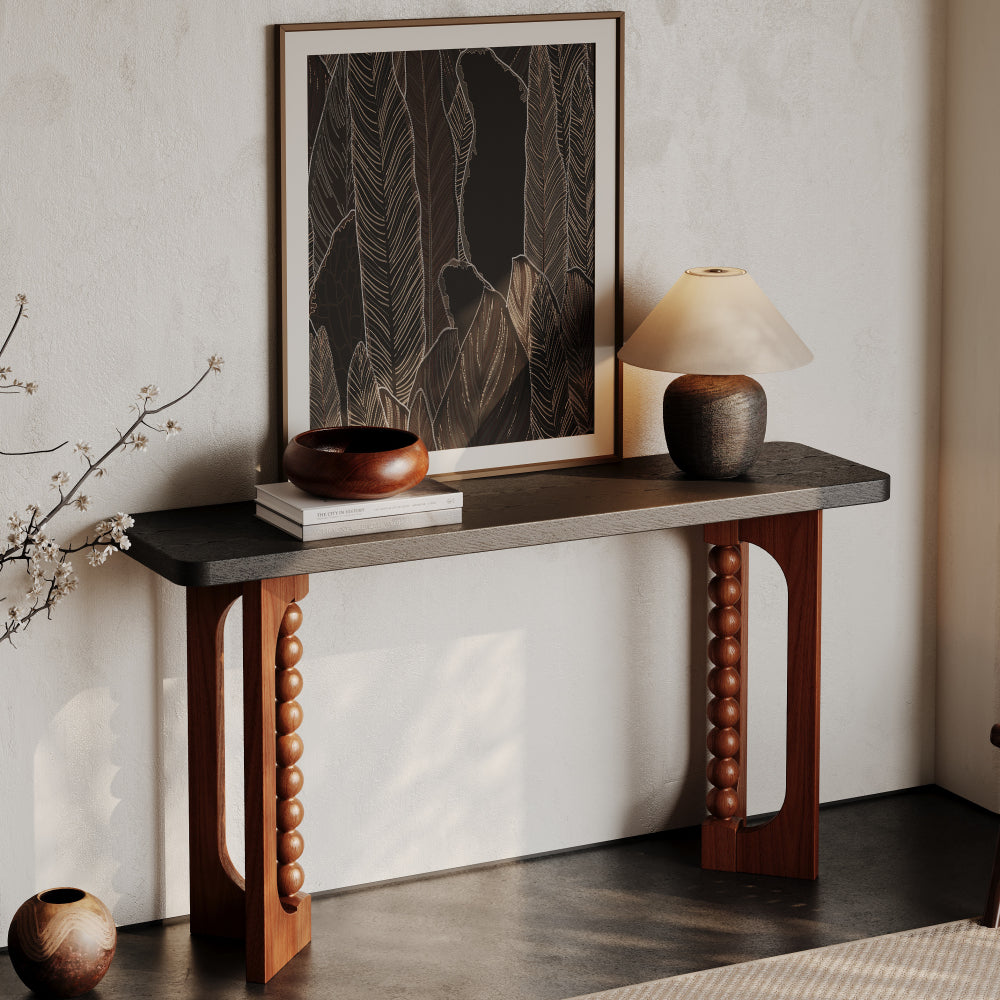 Angled room view of the dark-top console and beaded brown base.