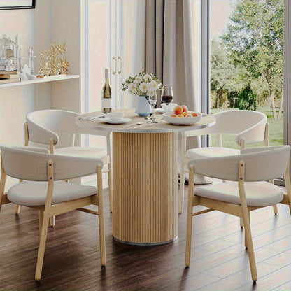 Beige table styled with separate dining chairs
