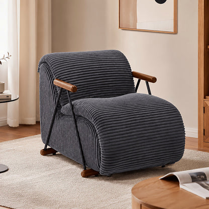 Gray wide corduroy lounge chair with wood arms and a black metal frame