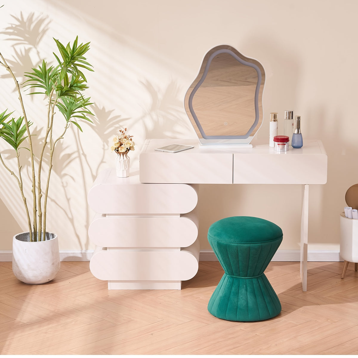 Green velvet ottoman styled at a makeup table