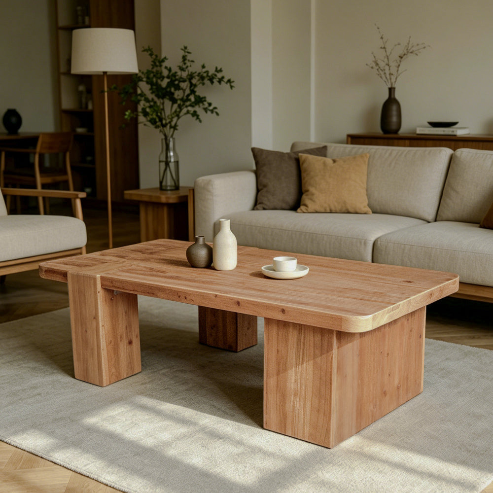 Warm brown coffee table with broad block legs in a living room