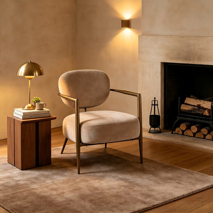 Camel fabric accent chair with an oval back and gold tone metal frame