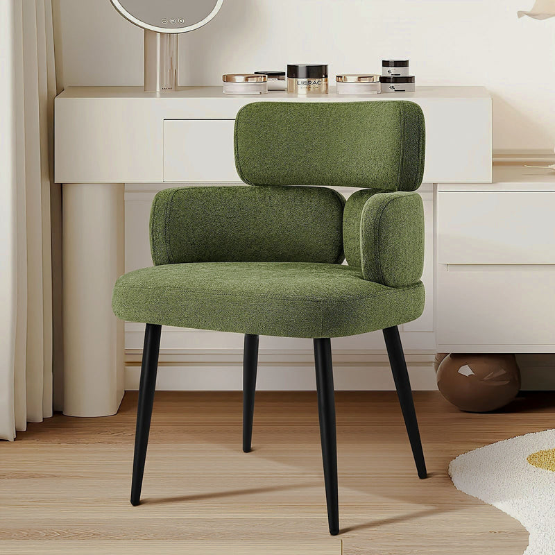 Green chenille accent chair with a segmented padded back and black metal legs