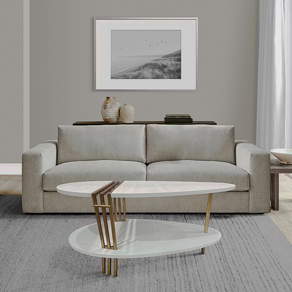 White oval coffee table by sofa
