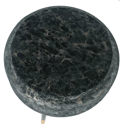 Overhead view of the ottoman's patterned round velvet cushion