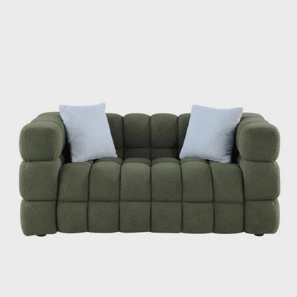 Front studio view of the olive green sofa with white pillows
