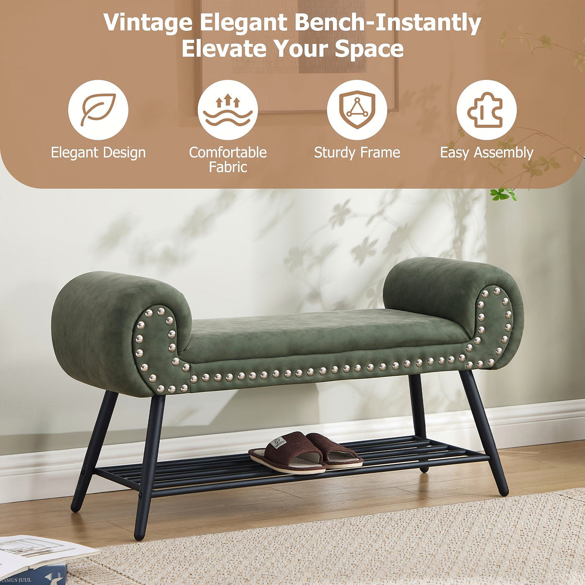 Green rolled arm upholstered shoe bench with a black metal rack and silver tone nailheads — entryway setting