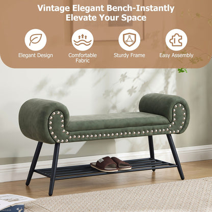 Green rolled arm upholstered shoe bench with a black metal rack and silver tone nailheads — entryway setting