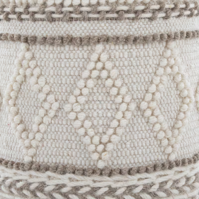 Close-up of raised diamond and braided upholstery pattern