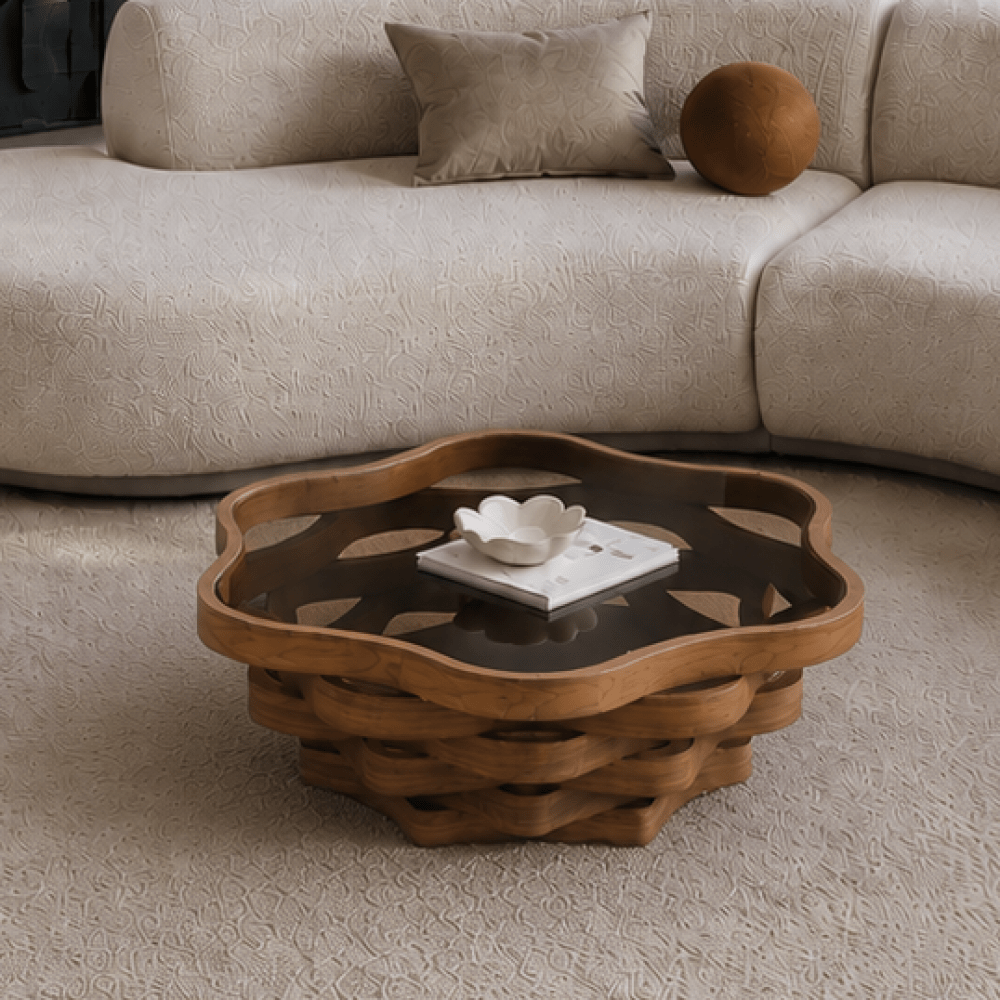 Cloud-shaped glass-top coffee table with layered brown base in a living room