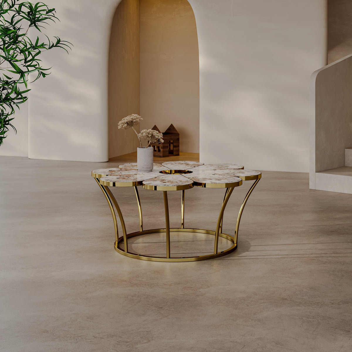 Front view of a flower-shaped coffee table and curved gold-tone frame