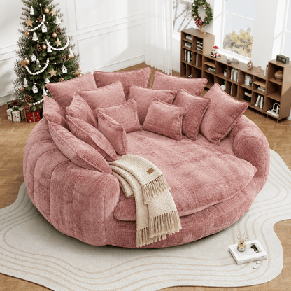 Oversized Round Chenille Lounge Sofa — pink upholstery in a holiday-styled living room.
