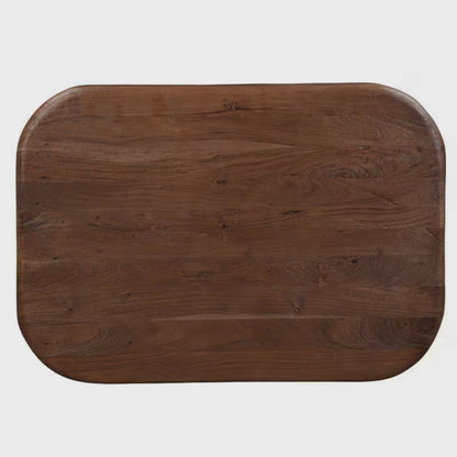 Overhead view of a broad brown coffee tabletop with rounded corners